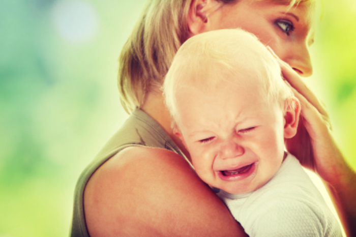 bigstock-mother-holding-her-crying-baby-61594103