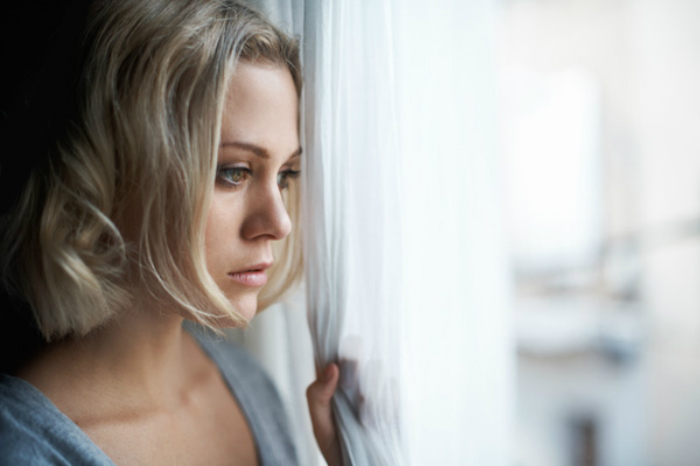 sad-woman-looking-out-window1