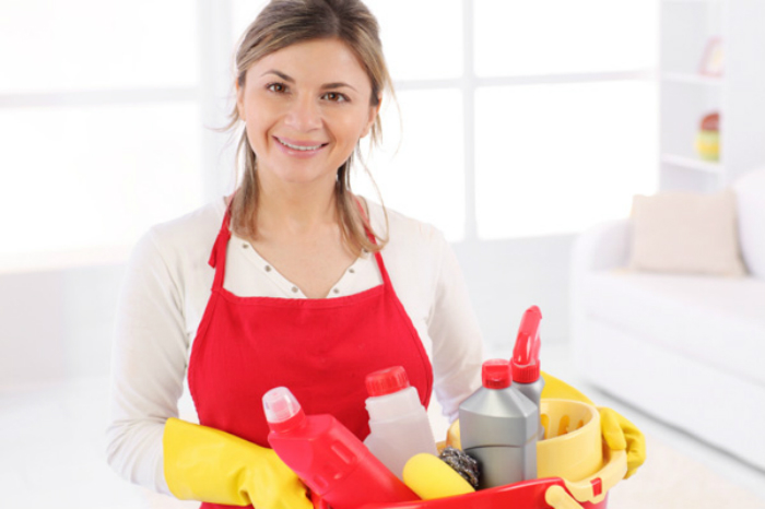 young-woman-smiling-after-finished-cleaning-in-home