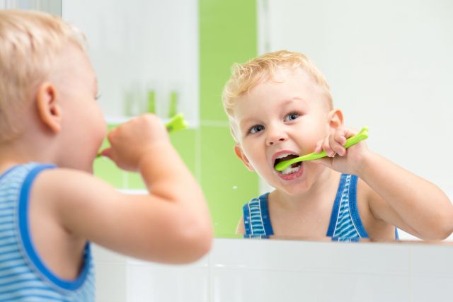 bigstock-Kid-Boy-Brushing-Teeth-60748295