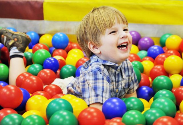 bigstock-happy-kid-playing-with-colored-26265224