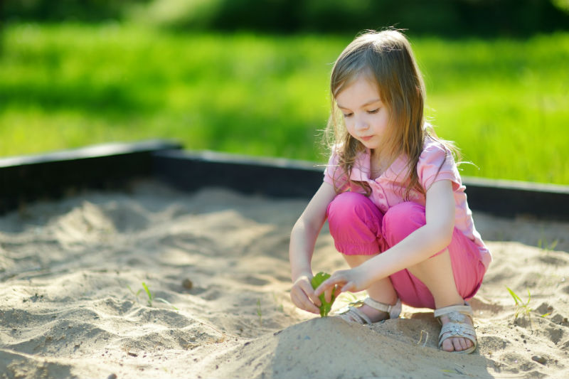 sandbox-sand-little-girl-playing