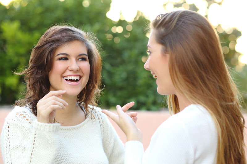 two-sisters-talking