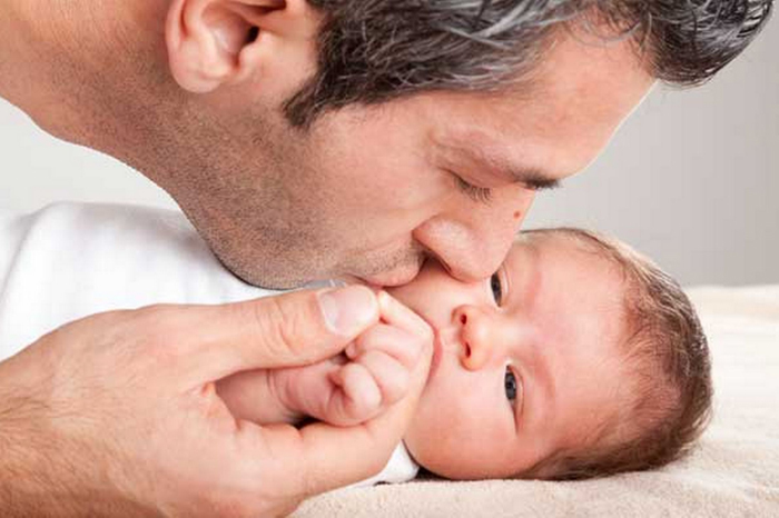 father_kissing_baby_boy_436169622_154338