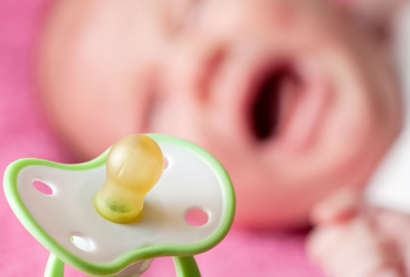 bigstock-Pacifier-Against-Crying-Baby-25213127