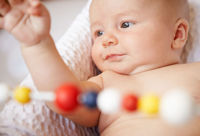 getty_rf_photo_of_baby_with_bead_toy