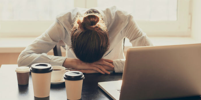 o-SITTING-AT-DESK-TIRED-facebook