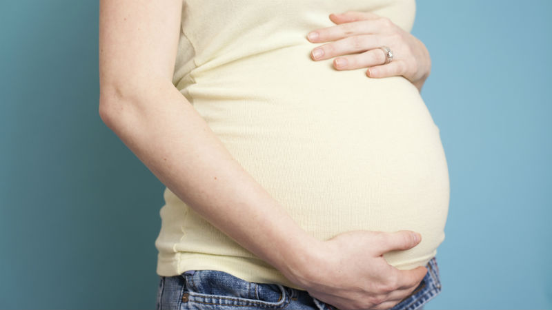 pregnant-woman-holding-stomach_ozlvjn