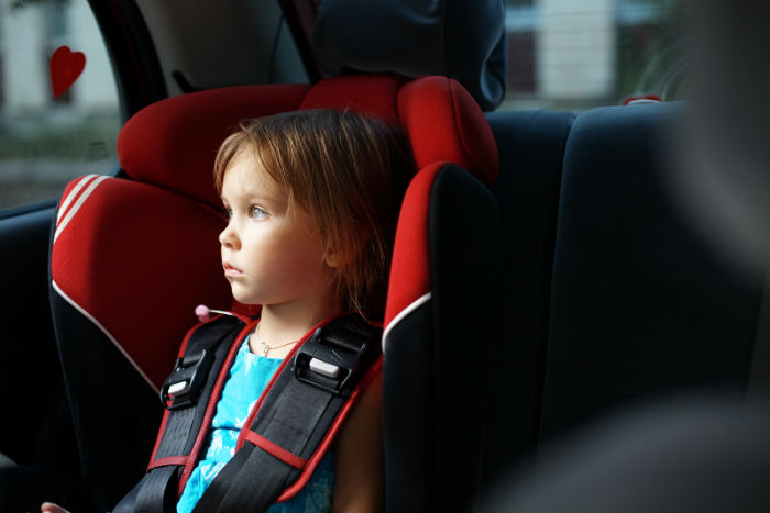 bigstock-Child-in-auto-baby-seat-in-car-12137609