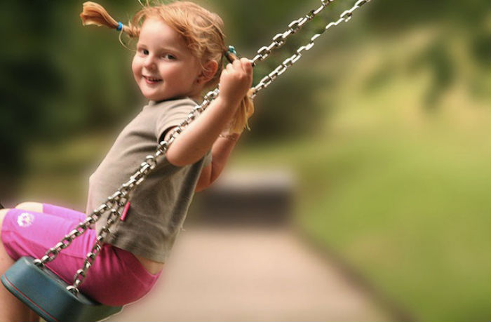 happy-kid-swinging