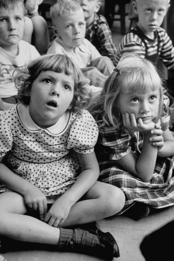 Wide-eyed children listening to fairy-tales on their first day at school.  (Photo by Leonard Mccombe/The LIFE Images Collection/Getty Images)